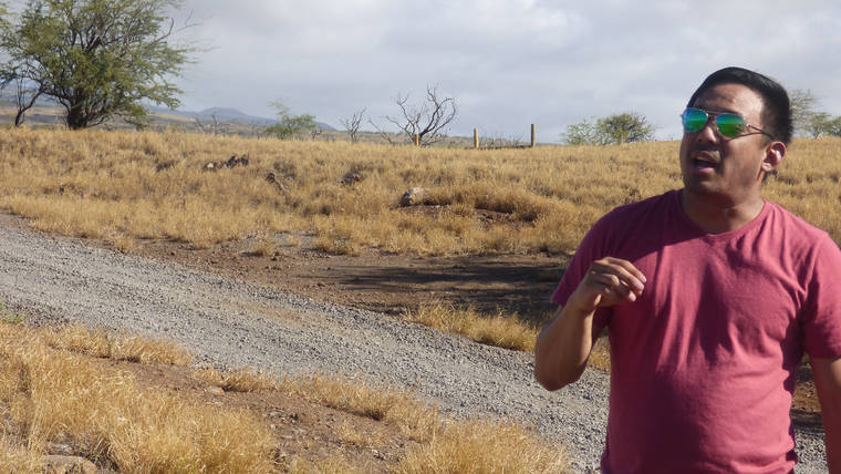 Yishan Wong speaks about his vision of reforestation on his 45-acre property in North Kohala Christmas Eve. (Tom Hasslinger/West Hawaii Today)